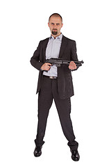 Image showing Mafia man is holding a shotgun