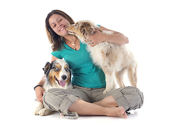 Image showing australian shepherds and woman