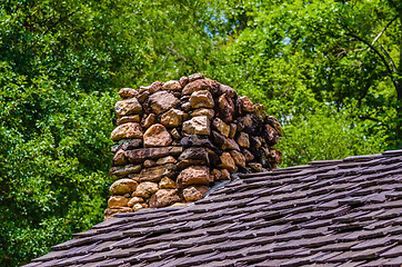 Image showing Stone Chimney on Rustic Cabin