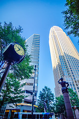 Image showing standing by the clock on city intersection at charlotte downtown