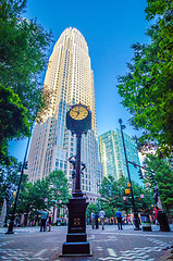 Image showing standing by the clock on city intersection at charlotte downtown