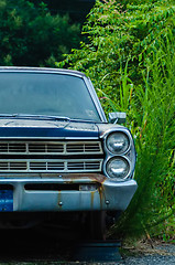 Image showing old abandoned car without  a wheel