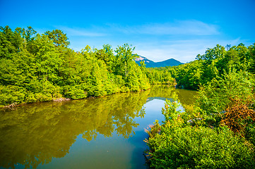 Image showing tabletop mountain with nature reflections in lake