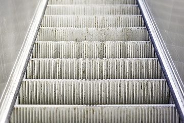 Image showing heavily used and worn escalator stairs