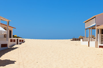 Image showing Beach sand encroaching on beachfront buildings