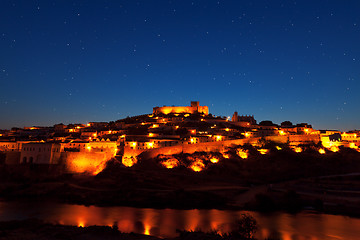 Image showing Walled town illuminated at night