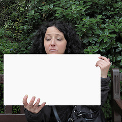 Image showing Girl holding banner