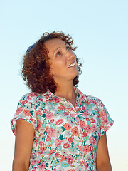 Image showing Joyful woman against blue sky