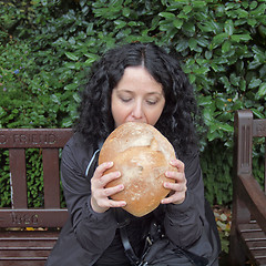 Image showing Girl eating bread