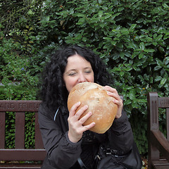 Image showing Girl eating bread