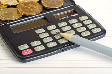 Image showing Calculator, coins and pencil