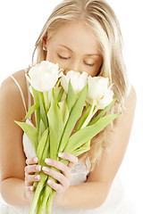 Image showing happy blond with white tulips