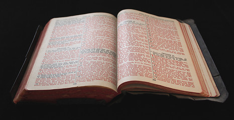 Image showing old Bible with red text