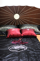 Image showing Bed with satin sheets