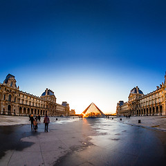 Image showing Sunset shines through the glass pyramid of the Louvre museum