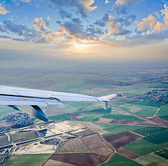 Image showing aerial view through airplane porthole 