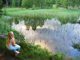 Image showing Young girl by lake