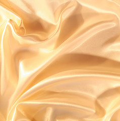 Image showing Smooth elegant golden satin as background