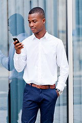 Image showing young successfil african businessman with mobilephone 