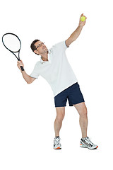 Image showing smiling adult tennis player with racket isolated