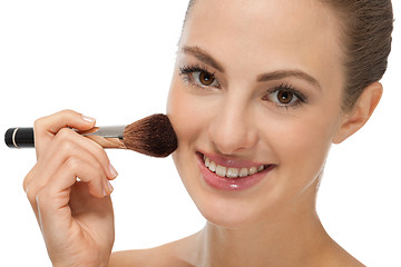 Image showing apllying powder make up on face portrait