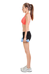 Image showing athletic young woman doing workout with physio tape latex tape