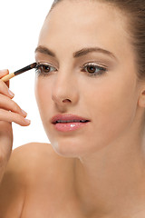 Image showing doing the makeup brown eyeshadow on beautiful eyes