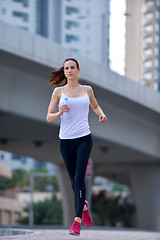 Image showing woman jogging at morning