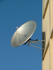 Image showing satellite dish attached to the house's wall