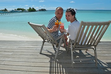 Image showing happy young couple relax and take fresh drink