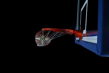 Image showing basketball ball and net on black background