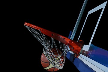 Image showing basketball ball and net on black background