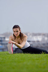 Image showing Young beautiful  woman jogging  on morning