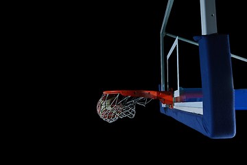 Image showing basketball ball and net on black background