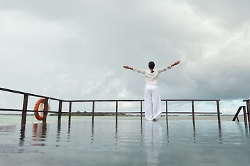 Image showing young woman relax on cloudy summer day