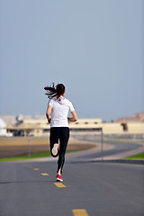 Image showing woman jogging at morning