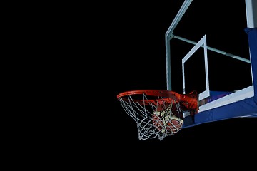 Image showing basketball ball and net on black background