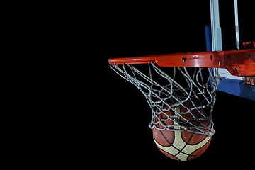 Image showing basketball ball and net on black background