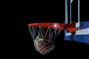 Image showing basketball ball and net on black background