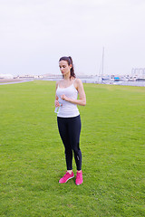 Image showing Young beautiful  woman jogging  on morning