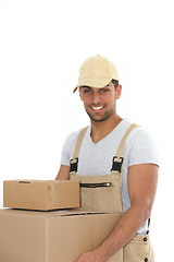 Image showing Workman carrying boxes