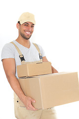 Image showing Confident young man carrying cardboard boxes