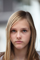 Image showing Young teenage girl with a serious expression