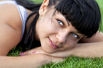 Image showing woman lies on grass