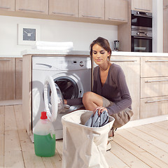 Image showing girl in the laundry room asm