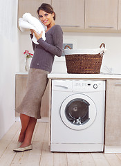 Image showing woman on washing machine