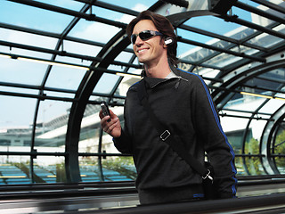 Image showing businessman walking in airport jilo