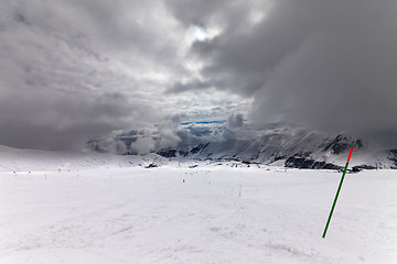 Image showing Slope for slalom and sky with storm clouds