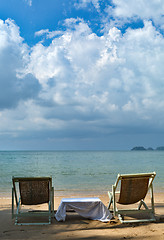 Image showing sun chairs on tropical beach