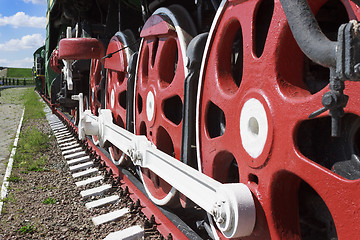 Image showing Wheels and coupling devices of a big locomotive